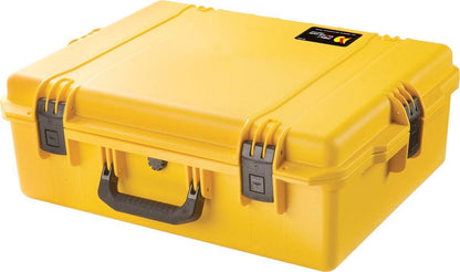 A yellow iM2700 Storm Case with hard plastic construction, black handle, two front latches, and a small top-right label. This crushproof case keeps your gear protected in any environment.