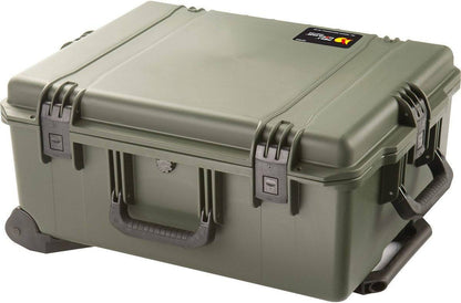 The iM2720 Storm Travel Case, shown in green with custom CNC foam, has a side handle, black wheeled base, and secure Press and Pull latches, all displayed on a white background.