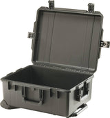 A large, black iM2720 Storm Travel Case with an open lid, custom CNC foam inserts for secure storage, Press and Pull latches, a front handle, and wheels at one end.