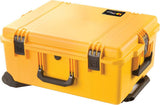 A yellow iM2720 Storm Travel Case with black Press and Pull latches, a handle, and custom CNC foam fittings sits on a flat surface.