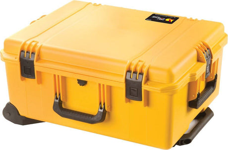 A yellow iM2720 Storm Travel Case with black Press and Pull latches, a handle, and custom CNC foam fittings sits on a flat surface.