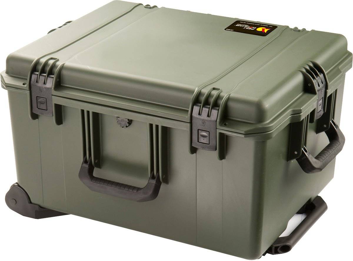The iM2750 Storm Travel Case is rugged, olive green with black latches, side handles, a wheeled base, custom foam inserts, and a small label on the lid.