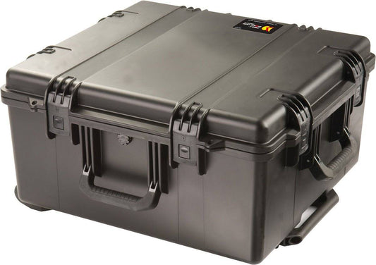 The iM2875 Storm Travel Case is a large, hard-shell black case with sturdy Press and Pull latches, side handles, custom CNC foam inserts, and a small top label.