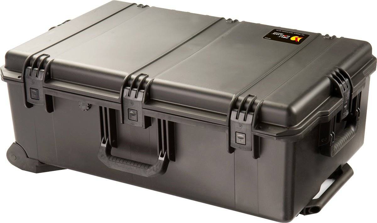 The iM2950 Storm Travel Case is a large black case with secure latches, a handle, reinforced edges, and custom CNC foam—ideal for safely transporting equipment.