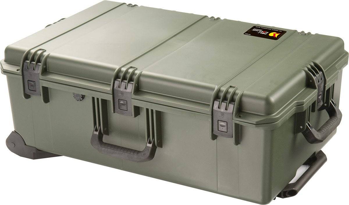 The iM2950 Storm Travel Case is a large, sturdy green case with black handles, secure latches, custom CNC foam inserts, and a small lid label, providing ultimate protection for your gear.