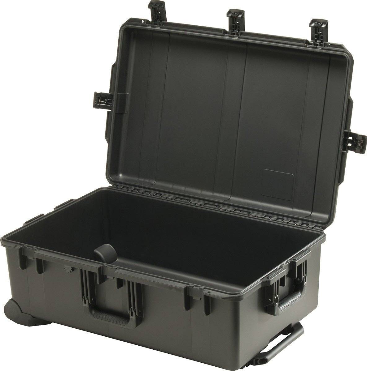 The iM2950 Storm Travel Case is a large, hard-shell black case with an open hinged lid and side handles, shown empty and ready for custom CNC foam fittings for superior protection.