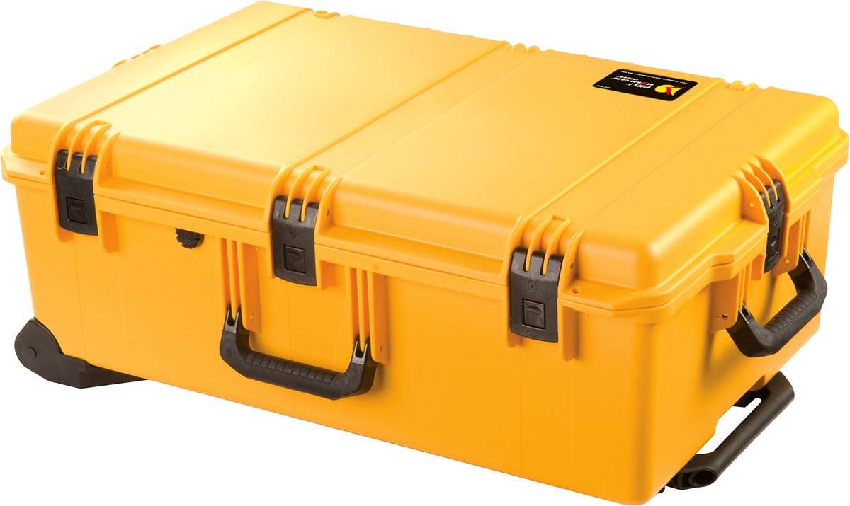 The iM2950 Storm Travel Case is a large, hard-shell yellow case with black handles, latches, and wheels, designed for secure storage and transport with custom CNC foam fittings.