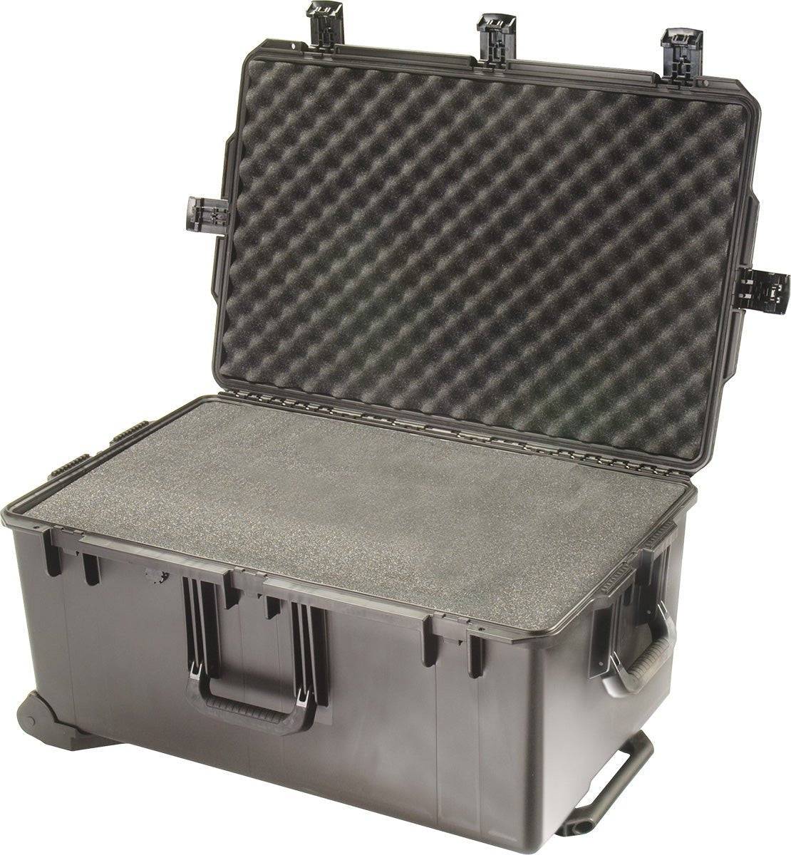 The black iM2975 Storm Travel Case features custom CNC foam, Press and Pull latches, front handles, and is shown open with latches unclasped for easy access and superior protection.