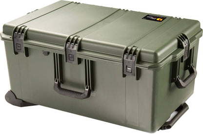 The large olive green iM2975 Storm Travel Case has durable black Press and Pull latches, side handles, custom CNC foam inside, and a small label on the lid.