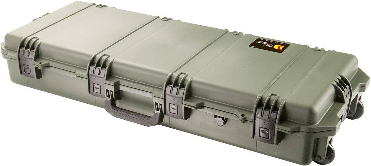 The olive green iM3100 Storm Long Case features a hard shell, black Press and Pull latches, center handle, wheels, and a corner label—perfect for custom CNC foam fittings.