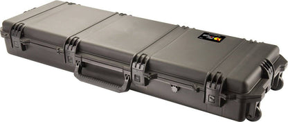 The iM3200 Storm Long Case is a large black case made from HPX Resin, featuring Press and Pull latches, a handle, wheels, and a label on one side for easy identification and secure storage.