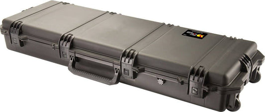 The iM3200 Storm Long Case is a large black case made from HPX Resin, featuring Press and Pull latches, a handle, wheels, and a label on one side for easy identification and secure storage.