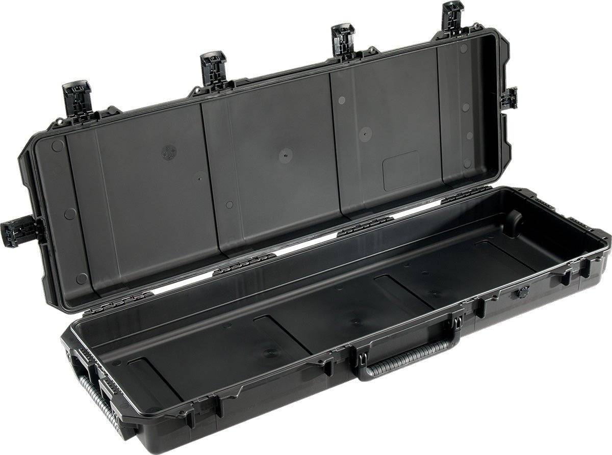 The iM3200 Storm Long Case is a large, hard-shell black case made from durable HPX Resin, open to reveal an empty interior, with Press and Pull latches and a sturdy handle.