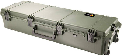 Olive green iM3220 Storm Long Case with reinforced edges, Press and Pull latches, carry handle, transport wheels, and custom CNC foam fittings, shown closed on a white background.