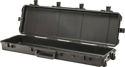 The open iM3300 Storm Long Case, a large black PELI case made of HPX Resin, features an empty interior, handle, wheels, and secure Press and Pull latches.