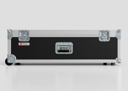 The Lid Maker Trunk Case is a rectangular black and silver flight case with metal edges, handles, latches, a red Nomad label on a plain gray background; its external dimensions are 1010 x 400 x 410 mm.