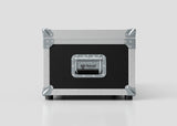 A black and silver Lid Maker Trunk Case with metal corners, a handle, and a Nomad label on the front sits on a plain white surface. Its external dimensions are 1010 x 400 x 410 mm.