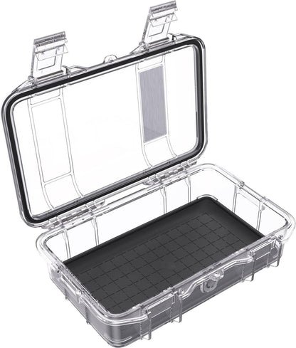 The M50 PELI Micro™ Case features a clear, hard plastic waterproof design with an open hinged lid and black grid-patterned base, ideal for protective storage.