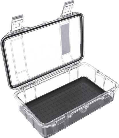 The M60 PELI Micro™ Case is a clear plastic IP67 case with an open hinged lid and black grid-patterned base, ideal as a waterproof protective case for your valuables.