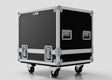The Medium Motorsport Engine Flight Case (775 x 650 x 650 mm) in black features heavy-duty metal edges, corner protectors, handles, and four caster wheels, shown on a plain light background.
