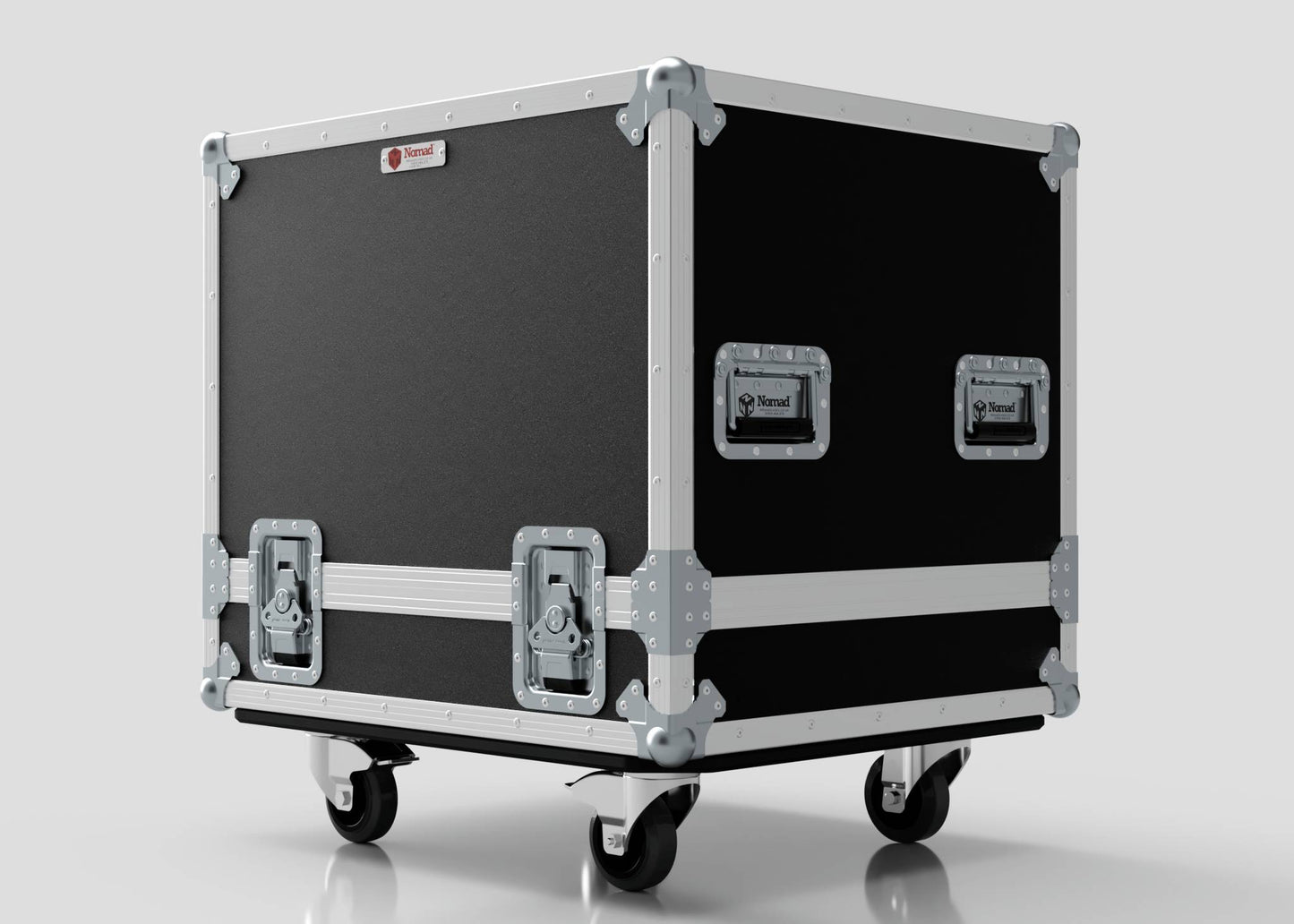The Small Engine Case, in black and silver with metal corners and handles, sits on four caster wheels against a plain background, highlighting its sturdy build and external dimensions of 710 x 610 x 605 mm.