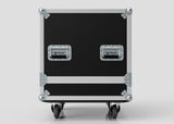 The Medium Motorsport Engine Flight Case (775 x 650 x 650 mm) is a black, rectangular case with metal reinforcements, two Nomad-branded handles, and four caster wheels, shown against a plain background.