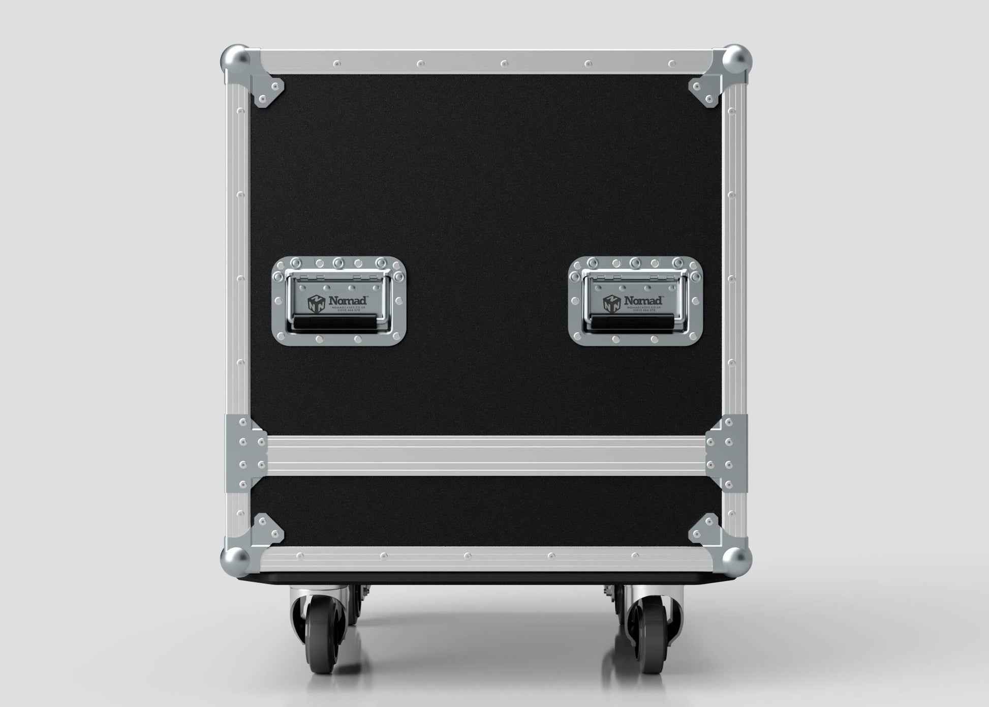 A Small Engine Case, black with metal reinforcements, two Nomad handles, and four caster wheels, shown front-facing against a plain background. External dimensions: 710 x 610 x 605 mm.