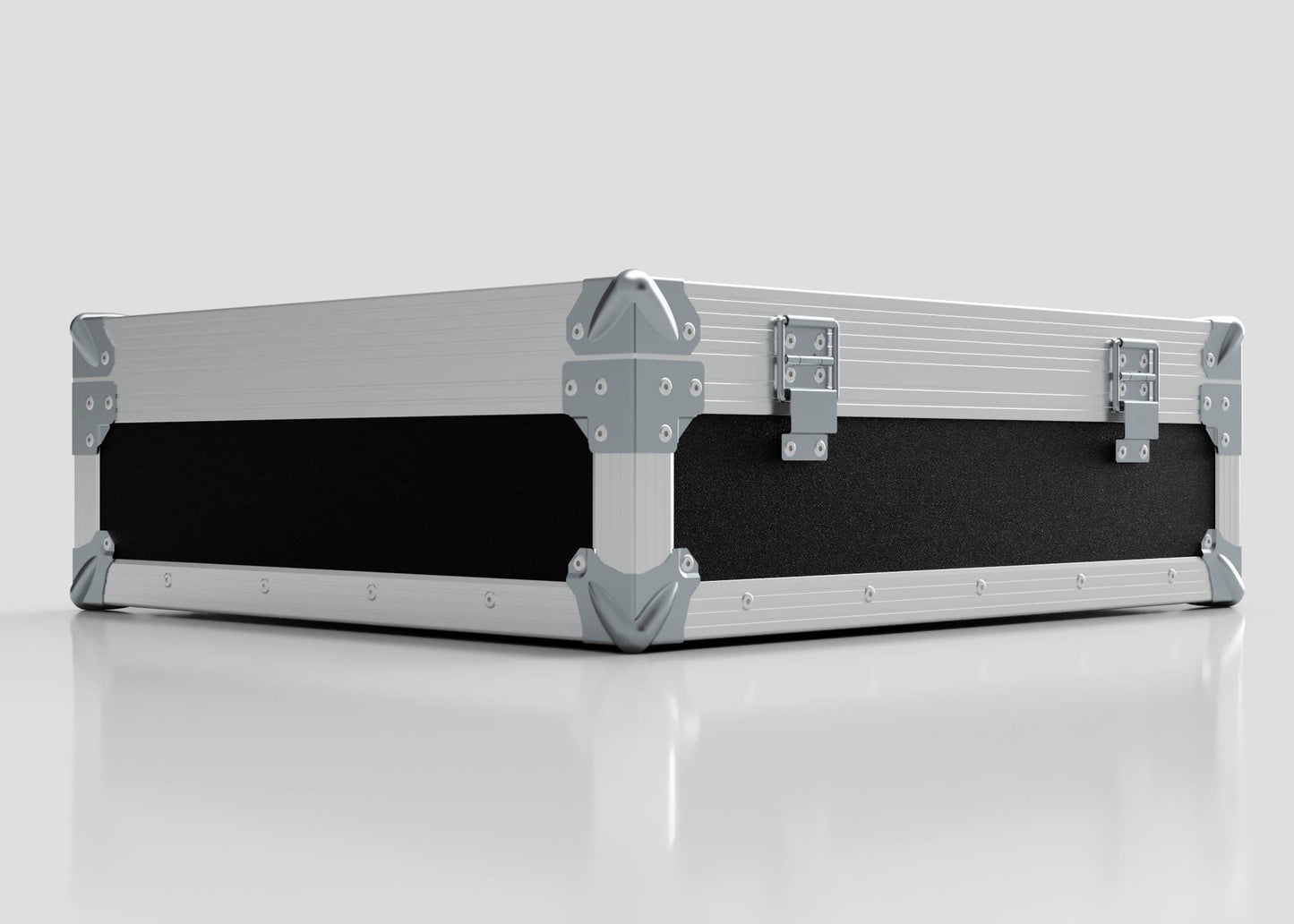 The Microphone Case is a rectangular, silver and black hard case with reinforced metal corners and two metal latches, measuring 577 x 526 x 192 mm, shown resting on a reflective white surface.