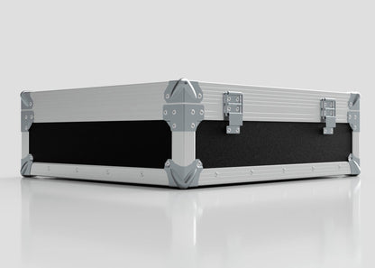 The Microphone Case is a rectangular, silver and black hard case with reinforced metal corners and two metal latches, measuring 577 x 526 x 192 mm, shown resting on a reflective white surface.