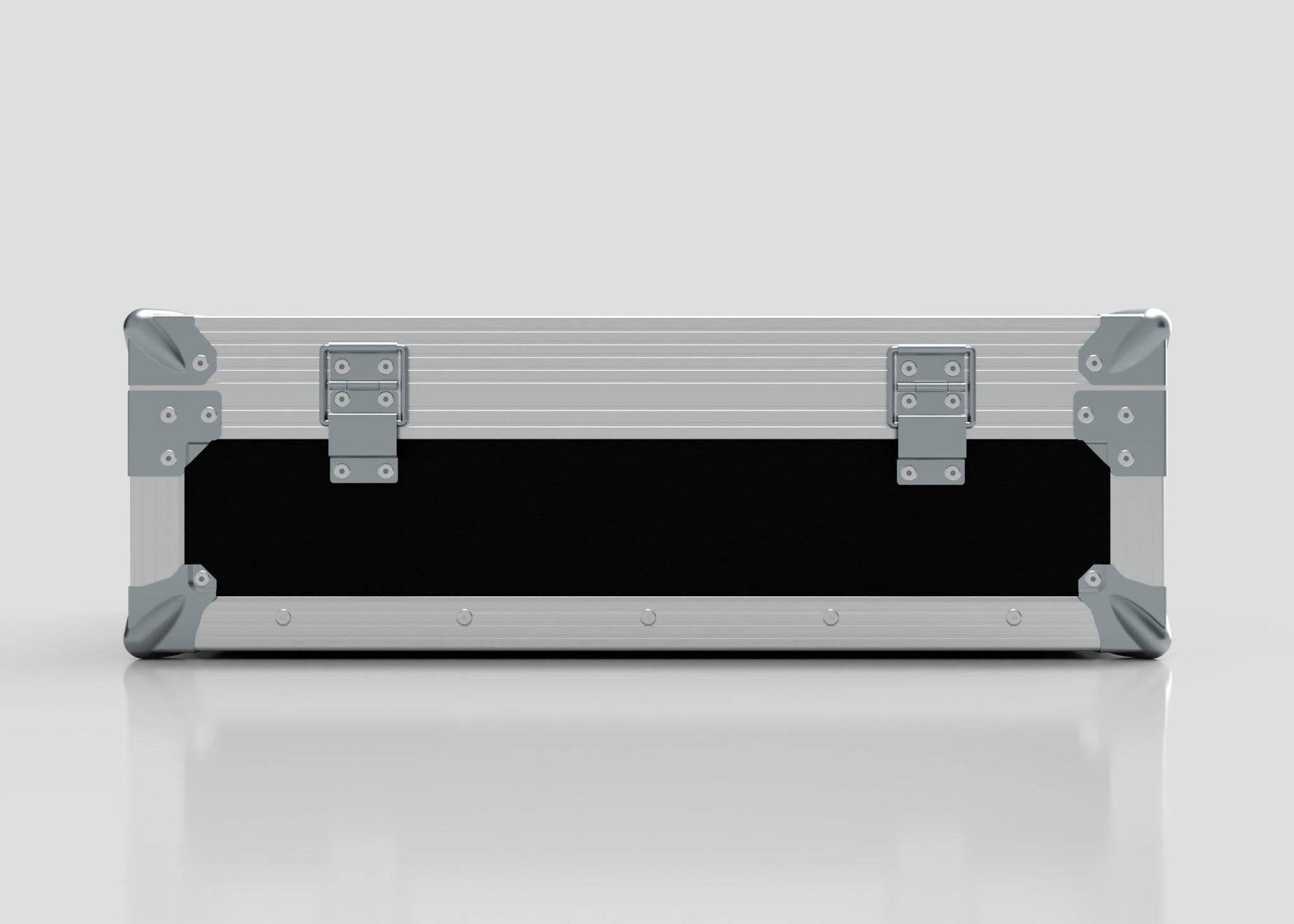 A closed, rectangular Microphone Case in silver with reinforced metal corners and two latches sits on a reflective surface; its external dimensions are 577 x 526 x 192 mm.