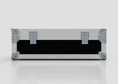A closed, rectangular Microphone Case in silver with reinforced metal corners and two latches sits on a reflective surface; its external dimensions are 577 x 526 x 192 mm.