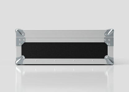 A sleek rectangular Microphone Case in metal and black, with reinforced silver corners and measuring 577 x 526 x 192 mm, is placed on a reflective white surface against a plain background.