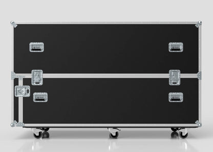 The Motorbike Case is a large black equipment case with metal edges, handles, and latches, mounted on four caster wheels. It stands against a plain light background and measures 2100 x 750 x 1150 mm externally.