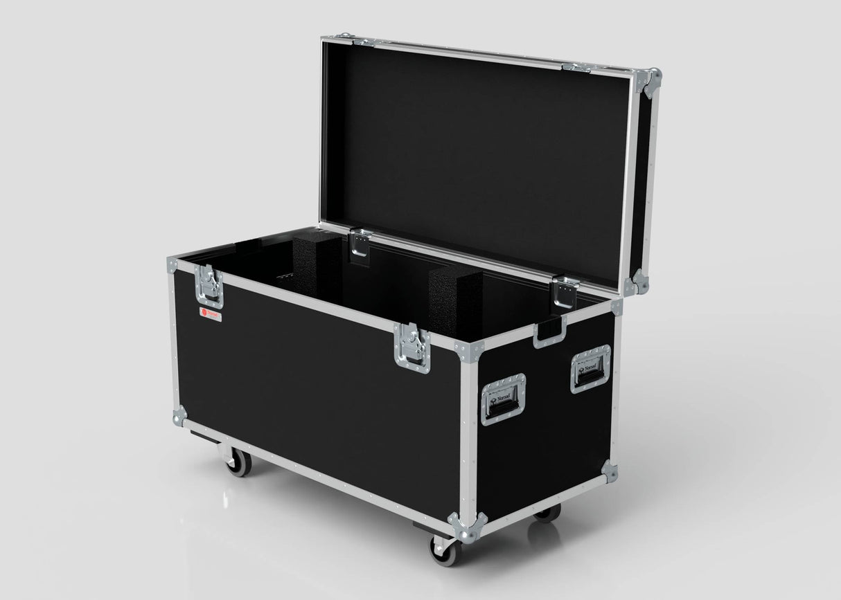 The Multicore Trunk Case, a large black road case with metal edges, handles, foam-lined interior, and four caster wheels, is open and set against a plain background.