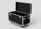 The Multicore Trunk Case, a large black road case with metal edges, handles, foam-lined interior, and four caster wheels, is open and set against a plain background.