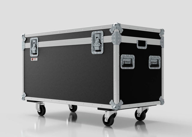 The Multicore Trunk Case, a large black and silver external storage box with metal edges, four handles, two latches, and four caster wheels, is shown against a white background.