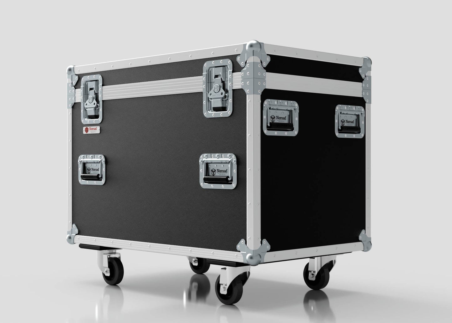 The MUT Trunk Case is a large black multi-utility road case with metal edges, reinforced corners, latches, handles, and four wheels, ideal for trunk pack compatible storage, shown against a plain light background.
