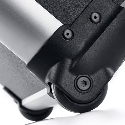 Close-up of a black plastic caster wheel attached to the Robust 50200N (555 x 425 x 235) case, featuring a metal and textured surface—ideal for impact-resistant equipment protection.