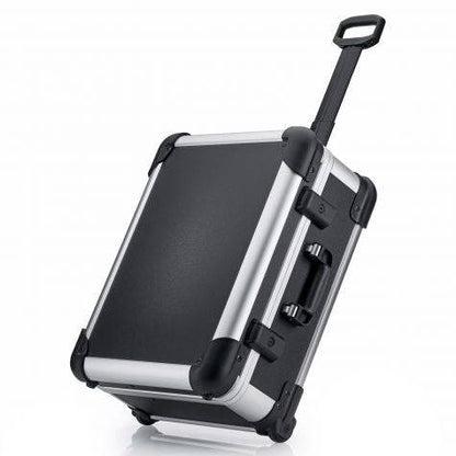The Robust 50200N (555 x 425 x 235) is a black and silver hard-shell rolling suitcase with a telescopic handle, displayed on one corner. It comes with custom foam fittings for enhanced protection.