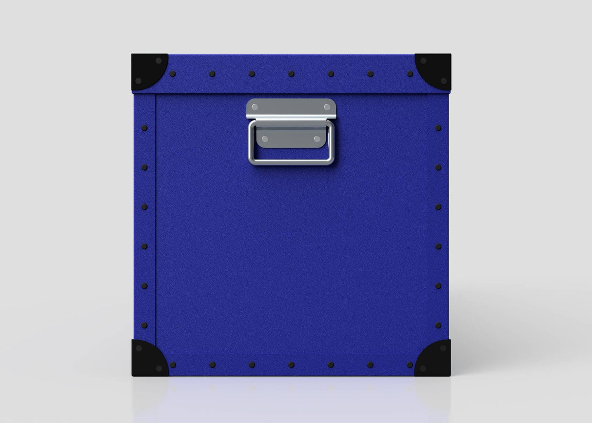 The Rugby Storage Poly Case (Large) is a square, blue durable case with black corner protectors, metal rivets on the edges, and a centered silver handle—perfect for rugby gear—shown against a plain white background.