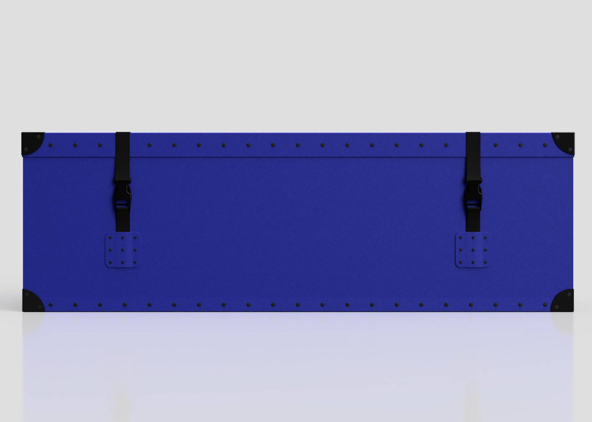 The Rugby Storage Poly Case (Medium)—a rectangular blue polyethylene box with black corner protectors and two side-release buckle straps—is displayed against a plain light background.