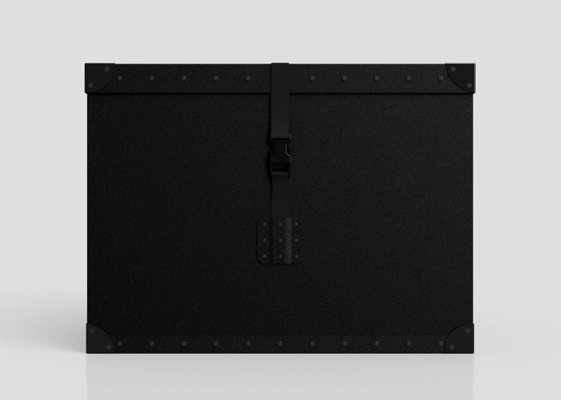 The Standard Cube Storage Box - Large is a rectangular black case with reinforced corners, metal rivets, and a central webbing buckle strap, shown against a plain light background.
