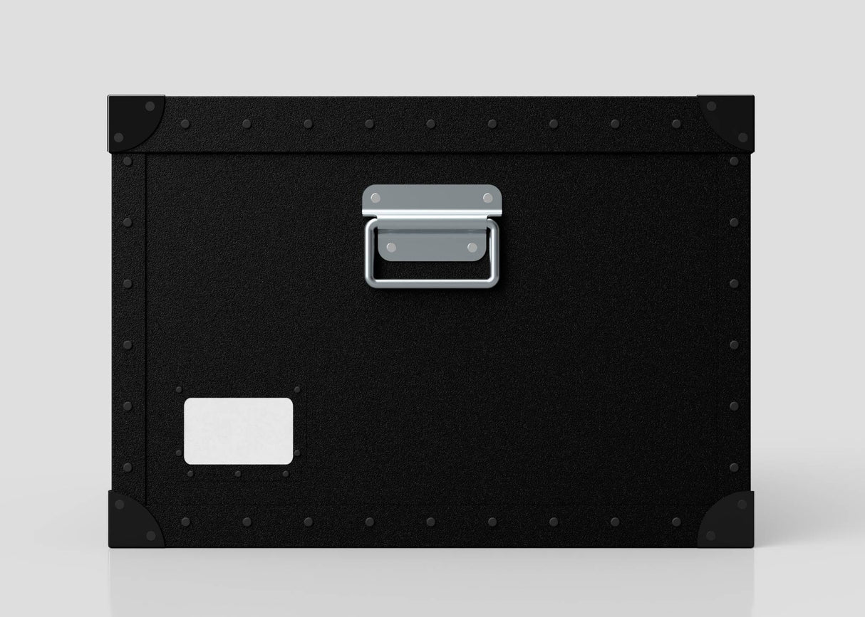 The Standard Cube Storage Box - Medium is black polyethylene with a metal handle, corner protectors, and a blank white label on the lower left corner.