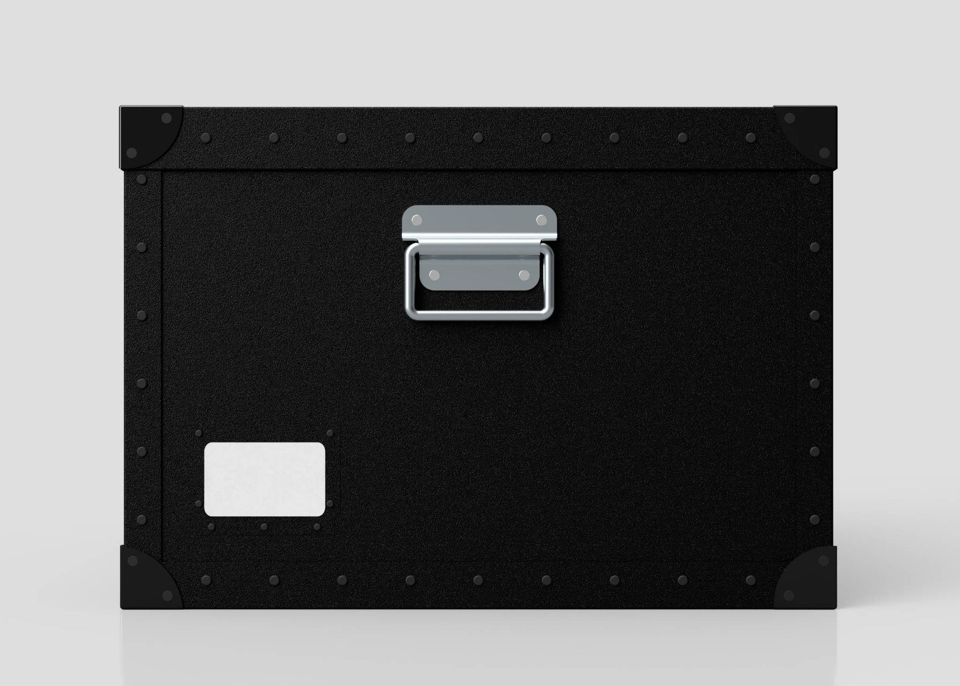 The Standard Cube Storage Box - Medium is black polyethylene with a metal handle, corner protectors, and a blank white label on the lower left corner.