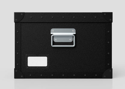 The Standard Cube Storage Box - Small is a black polyethylene box with a metal handle, reinforced corners, and a poly card holder for labeling, shown against a plain light background.