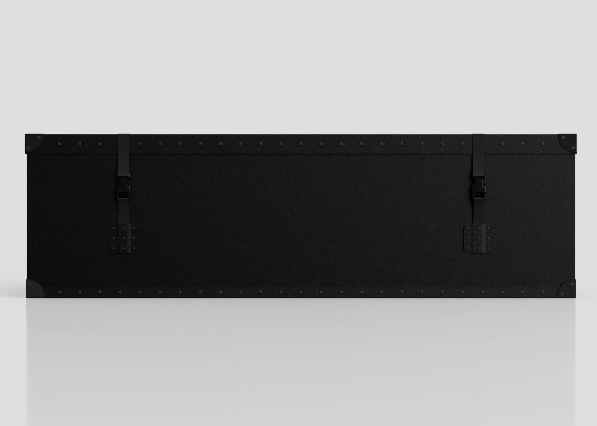 The Standard Long Storage Box - Large is a rectangular black case with metal corner protectors, rivets, two latch straps, and a sturdy zinc drop handle, shown against a plain light background.