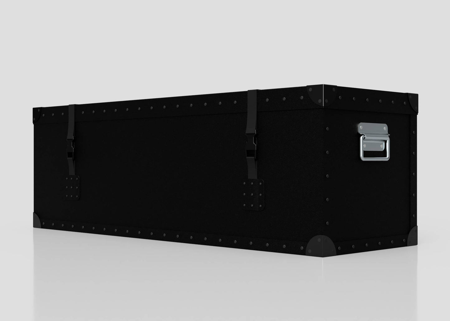 A Standard Long Storage Box - Medium, rectangular and black with metal rivets, corner protectors, two latches, and a zinc drop handle sits on a reflective surface against a plain background.