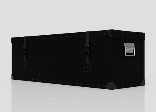 A Standard Long Storage Box - Medium, rectangular and black with metal rivets, corner protectors, two latches, and a zinc drop handle sits on a reflective surface against a plain background.