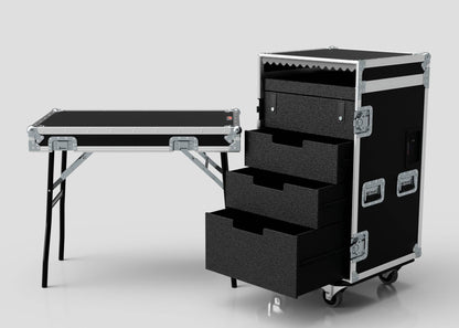 The TM TV Drawer Case is a black road case with metal reinforcements, three open drawers, caster wheels, and a detachable lid that serves as a trestle table with fold-out legs—ideal for storage and workspace with efficient dimensions.