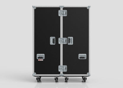 The Touring Wardrobe Case with Shoe Drawers is a large black road case featuring metal edges, handles, and latches. It stands upright on four wheels and has external dimensions of 1179 x 680 x 1569 mm.